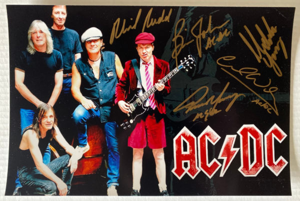 ACDC band signed autographed 8×12 photo Angus Young Brian Johnson Malcolm Young autographs AC/DC Prime Autographs - Top Celebrity Signatures Celebrity Signatures