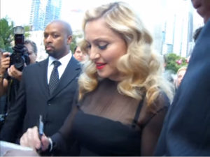 madonna signing autographs for prime autographs autographed memorabilia store w1441 o
